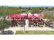 Aerial view of covered outdoor restaurant patio with tables, chairs, and shade canopies at 9750 E Radioactive Dr, Mesa, AZ 85212