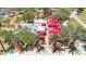 Aerial view of a restaurant exterior with outdoor seating, red canopies, and a vibrant sidewalk at 9750 E Radioactive Dr, Mesa, AZ 85212