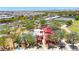 Aerial view of a restaurant with an outdoor patio, surrounded by trees, a garden, and residential buildings at 9750 E Radioactive Dr, Mesa, AZ 85212