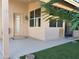 A well-manicured backyard featuring artificial turf, a covered patio, and easy access to the home at 9853 W Pontiac Dr, Peoria, AZ 85382