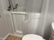 Walk-in bathtub with shower head, white walls, and door for access at 9853 W Pontiac Dr, Peoria, AZ 85382