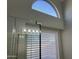 Bright bathroom with a glass door, light fixtures, and natural lighting at 9853 W Pontiac Dr, Peoria, AZ 85382