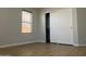 Bedroom with closet with doors and natural light entering through a window at 9853 W Pontiac Dr, Peoria, AZ 85382