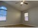 Bedroom with a ceiling fan and light and natural light entering through windows at 9853 W Pontiac Dr, Peoria, AZ 85382