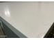 Close-up shot of bright, clean quartz countertop with subtle veining detail at 9853 W Pontiac Dr, Peoria, AZ 85382