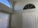 Entryway with architectural windows and a white door at 9853 W Pontiac Dr, Peoria, AZ 85382