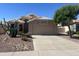 Charming single-story home with desert landscaping, a two-car garage, and a neutral color palette at 9853 W Pontiac Dr, Peoria, AZ 85382