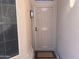 A close-up of the front door, it features a secure screen door and is well-lit at 9853 W Pontiac Dr, Peoria, AZ 85382