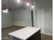 Open concept kitchen with central island, pendant lighting, and stainless steel appliances at 9853 W Pontiac Dr, Peoria, AZ 85382