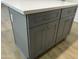 A close-up of the kitchen island featuring plenty of storage and light countertop at 9853 W Pontiac Dr, Peoria, AZ 85382
