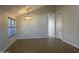 Bright living room with hardwood flooring, a modern chandelier, and natural lighting at 9853 W Pontiac Dr, Peoria, AZ 85382