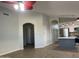 Spacious living room with wood-look flooring and open flow to the kitchen at 9853 W Pontiac Dr, Peoria, AZ 85382