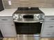 Close-up of a stainless steel range with sleek design and modern touch controls at 9853 W Pontiac Dr, Peoria, AZ 85382