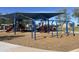 Shaded community playground with swings, slides, and climbing structures on wood chip surface at 9853 W Pontiac Dr, Peoria, AZ 85382
