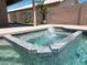 The backyard showcases a beautiful pool, with fountain feature, ideal for relaxation and enjoyment at 9853 W Pontiac Dr, Peoria, AZ 85382