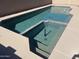 This serene pool features a spa, tanning shelf, and easy access steps, great for cooling off at 9853 W Pontiac Dr, Peoria, AZ 85382