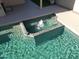 Inviting in-ground pool featuring a tranquil water fountain and clear, refreshing water at 9853 W Pontiac Dr, Peoria, AZ 85382