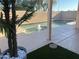 Backyard pool is framed by lush greenery and ample patio space for entertaining at 9853 W Pontiac Dr, Peoria, AZ 85382