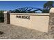 Stone community entrance sign with the Parkridge name and metal sun decoration at 9853 W Pontiac Dr, Peoria, AZ 85382