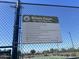 Community tennis court regulations posted for residents at 9853 W Pontiac Dr, Peoria, AZ 85382