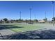 Well maintained community tennis court with lights and benches at 9853 W Pontiac Dr, Peoria, AZ 85382