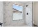 Modern shower with marble tiling and a window offering natural light at 1030 E Wescott Dr, Phoenix, AZ 85024