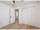Bedroom featuring closet, ceiling fan, and modern wood floors at 1030 E Wescott Dr, Phoenix, AZ 85024