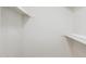 A walk-in closet with white walls and shelving, providing ample storage space at 1030 E Wescott Dr, Phoenix, AZ 85024