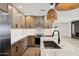 Modern kitchen with a large island, marble countertops, and stainless steel appliances at 1030 E Wescott Dr, Phoenix, AZ 85024