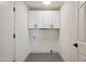 Well-lit laundry room with white cabinets and modern fixtures at 1030 E Wescott Dr, Phoenix, AZ 85024