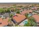 Aerial view features pool and backyard of this home in a well maintained neighborhood at 10580 E Bella Vista Dr, Scottsdale, AZ 85258