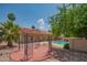 Private backyard with a pool, patio, pergola, and lush landscaping for relaxation and entertainment at 10580 E Bella Vista Dr, Scottsdale, AZ 85258