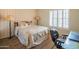 Bedroom with carpet, a large bed, shuttered windows, and desk with chair at 10580 E Bella Vista Dr, Scottsdale, AZ 85258
