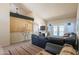 A comfy living area featuring high ceilings, large sofa, and patio doors at 10580 E Bella Vista Dr, Scottsdale, AZ 85258
