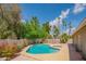 Relaxing backyard pool area with well-maintained landscaping, mature trees, and a charming patio at 10580 E Bella Vista Dr, Scottsdale, AZ 85258