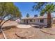Expansive backyard featuring a covered patio and desert landscaping, perfect for outdoor relaxation and entertaining at 10610 W Diana Ave, Peoria, AZ 85345