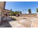 Backyard showcases mature trees, a covered patio, and ample space for customization and entertaining at 10610 W Diana Ave, Peoria, AZ 85345