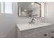 Modern bathroom vanity featuring white cabinets, gold accents, and a stunning backsplash at 10610 W Diana Ave, Peoria, AZ 85345