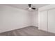 Bright bedroom featuring neutral carpet, ceiling fan, and sliding-door closet for ample storage at 10610 W Diana Ave, Peoria, AZ 85345