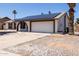 Inviting single-story home featuring solar panels, desert landscaping, and an arched entryway at 10610 W Diana Ave, Peoria, AZ 85345