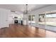 Bright, open kitchen features white cabinetry, stainless steel appliances, and sliding glass doors to backyard at 10610 W Diana Ave, Peoria, AZ 85345