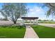Backyard pergola with columns, pavers and fire pit for outdoor relaxation at 10755 E Cholla Ln, Scottsdale, AZ 85259