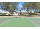 Home's basketball court provides outdoor exercise with a view of the well-maintained home at 10755 E Cholla Ln, Scottsdale, AZ 85259