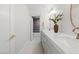 Stylish bathroom featuring double sinks, a modern vanity, a walk-in shower, and quartz countertops at 10755 E Cholla Ln, Scottsdale, AZ 85259