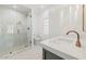 Elegant bathroom featuring a glass shower, modern sink, and sleek fixtures at 10755 E Cholla Ln, Scottsdale, AZ 85259