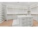 Walk-in closet with custom shelving and drawers at 10755 E Cholla Ln, Scottsdale, AZ 85259