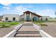 Inviting home exterior with manicured landscaping and stone accents at 10755 E Cholla Ln, Scottsdale, AZ 85259