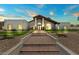Stunning home exterior with a brick walkway and desert landscaping at 10755 E Cholla Ln, Scottsdale, AZ 85259