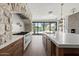 Gourmet kitchen with a marble island, custom cabinets, and premium appliances at 10755 E Cholla Ln, Scottsdale, AZ 85259