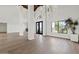 Airy living room featuring modern lighting and large windows for natural light at 10755 E Cholla Ln, Scottsdale, AZ 85259
